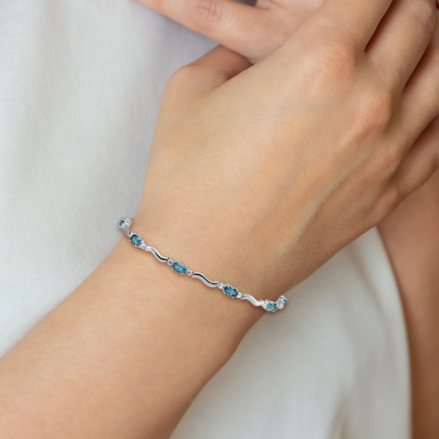 10k White Gold Fancy Diamond and Blue Topaz Bracelet