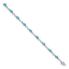 10k White Gold Blue Topaz and Diamond Infinity Bracelet