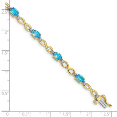 10k Blue Topaz and Diamond Infinity Bracelet